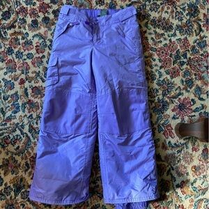 Champion snow pants in lilac. Elastic cuffs keep snow out; reinforced butt.